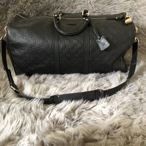 Black leather Gucci duffel bag